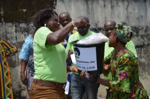 KMJ Foundation volunteer with a Bucket of Love recipient