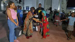 Women receive gifts at the KMJ Foundation Christmas Eve distribution